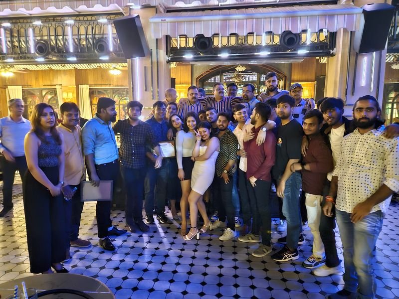Colleagues posing together at an evening team event