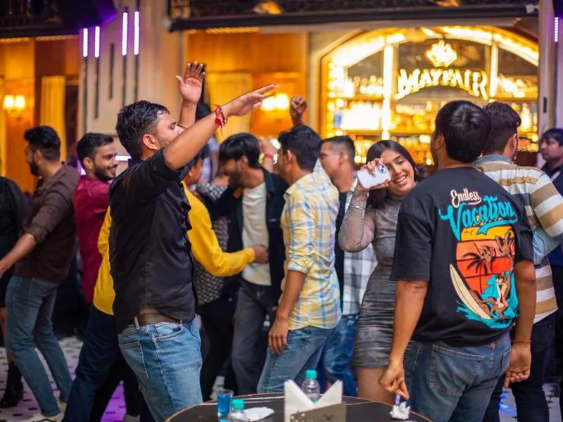 Colleagues dancing together at a team night out