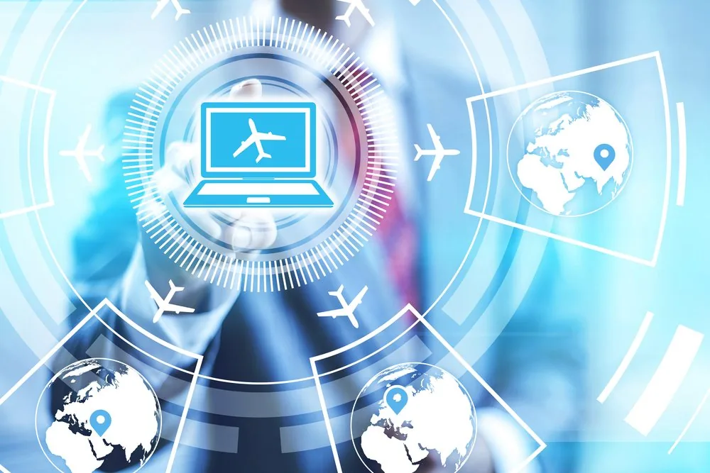 A laptop surrounded by flight paths and destination pins